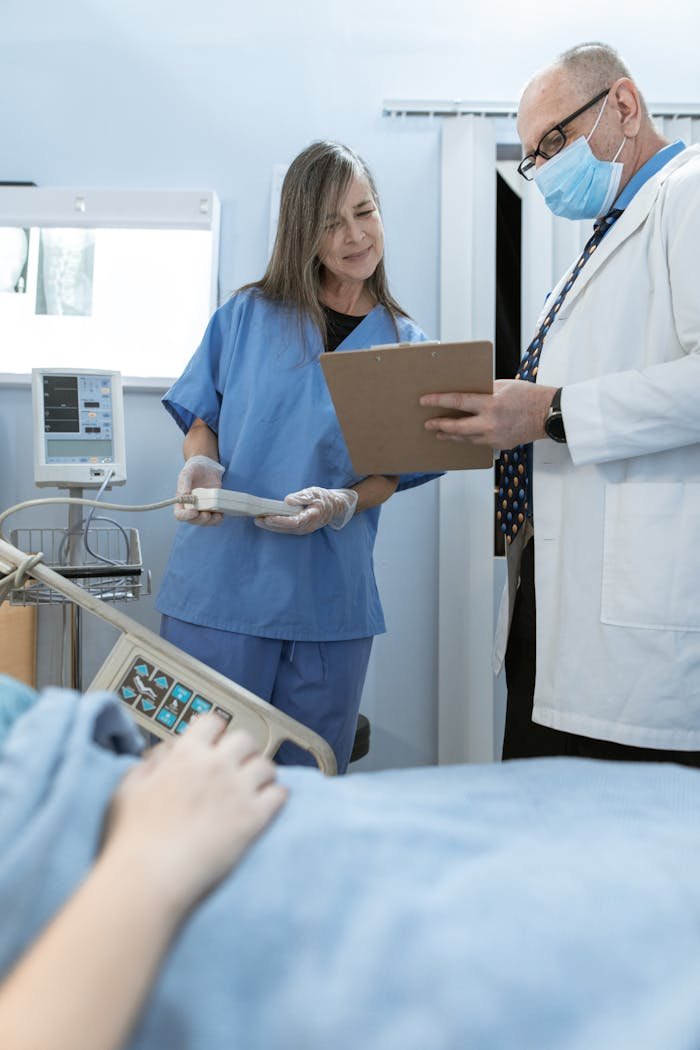 The Art of Drawing Readers In: Your attractive post title goes here Doctor and nurse discussing patient care in a hospital setting